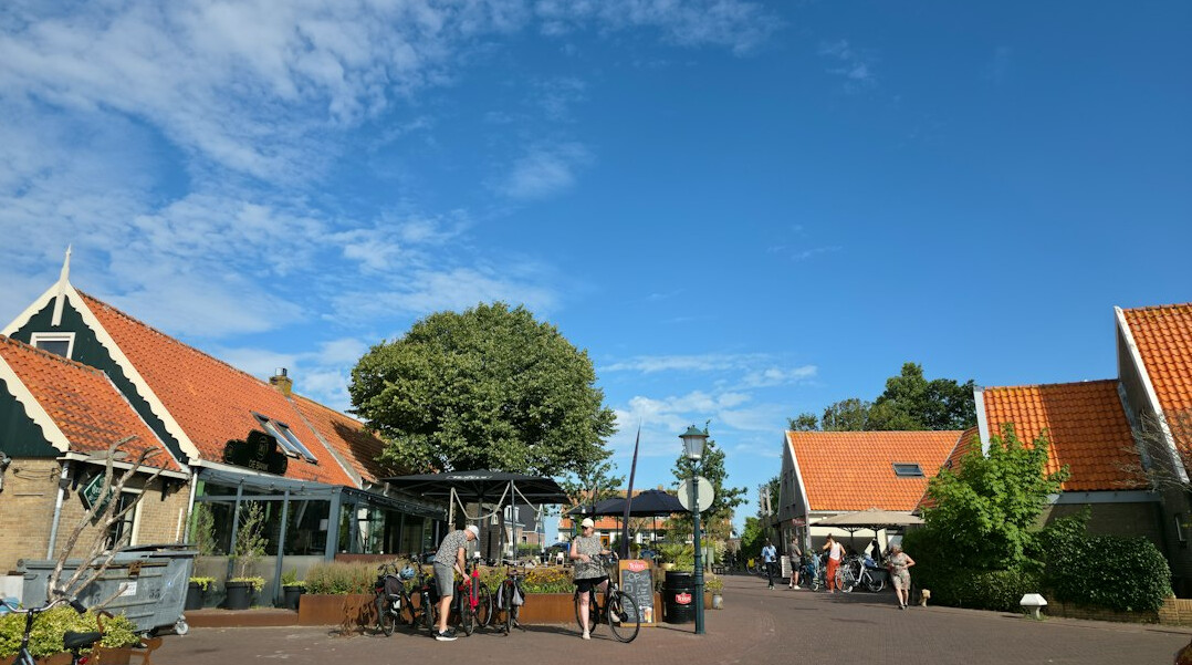 Small Danish village square with cobblestones and passersby