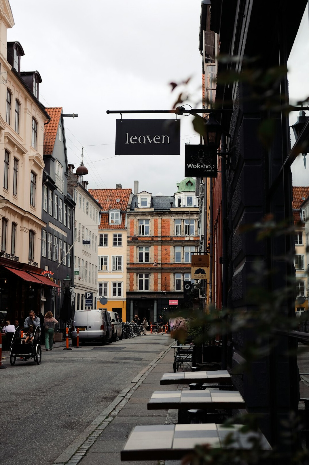 Street life scene in central Copenhagen with pedestrians and cafes
